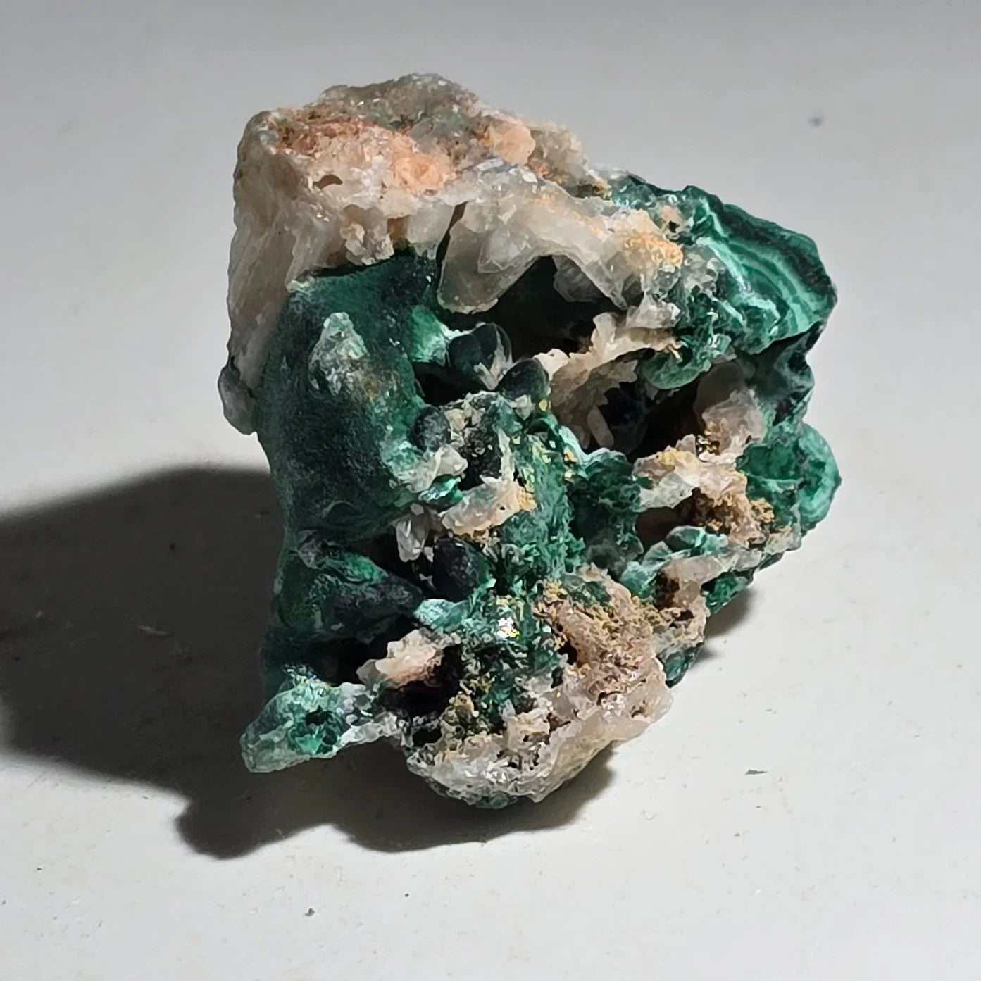 Malachite with quartz matrix, vibrant green botryoidal formations on white host rock