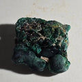 Malachite mineral specimen with botryoidal formations, vibrant green crystal clusters on matrix