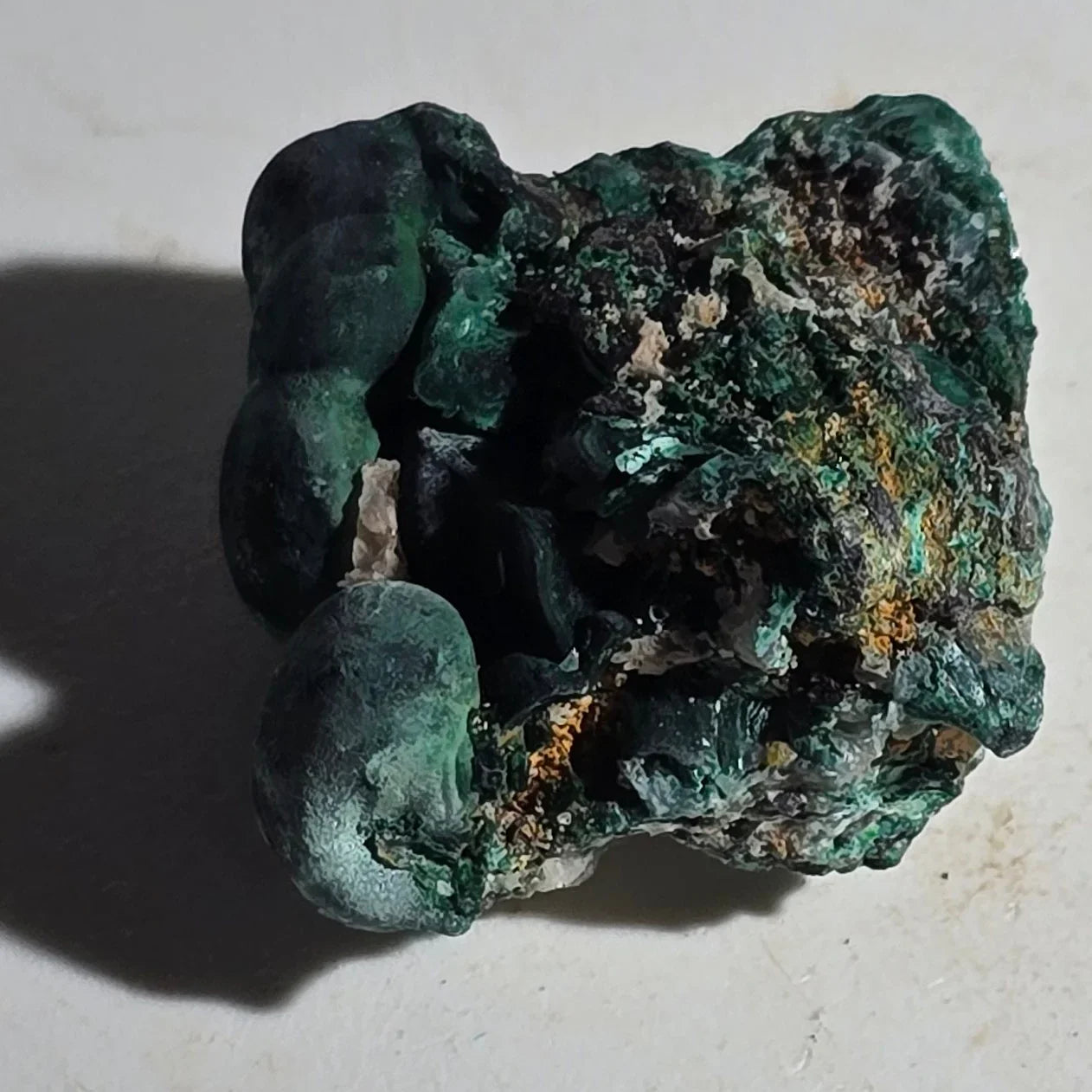 Malachite mineral specimen with vibrant green botryoidal formations, natural crystal texture