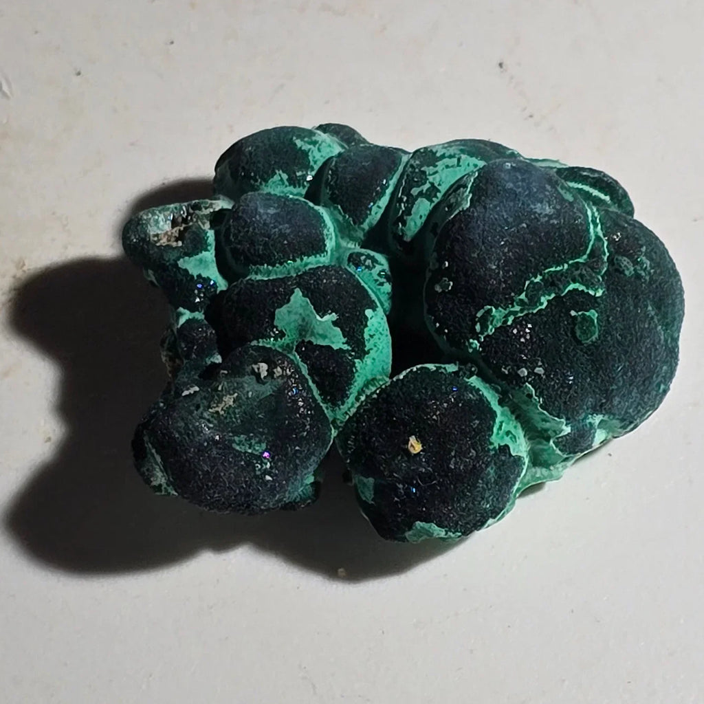 Malachite botryoidal specimen with vibrant green and dark bands, natural mineral formation
