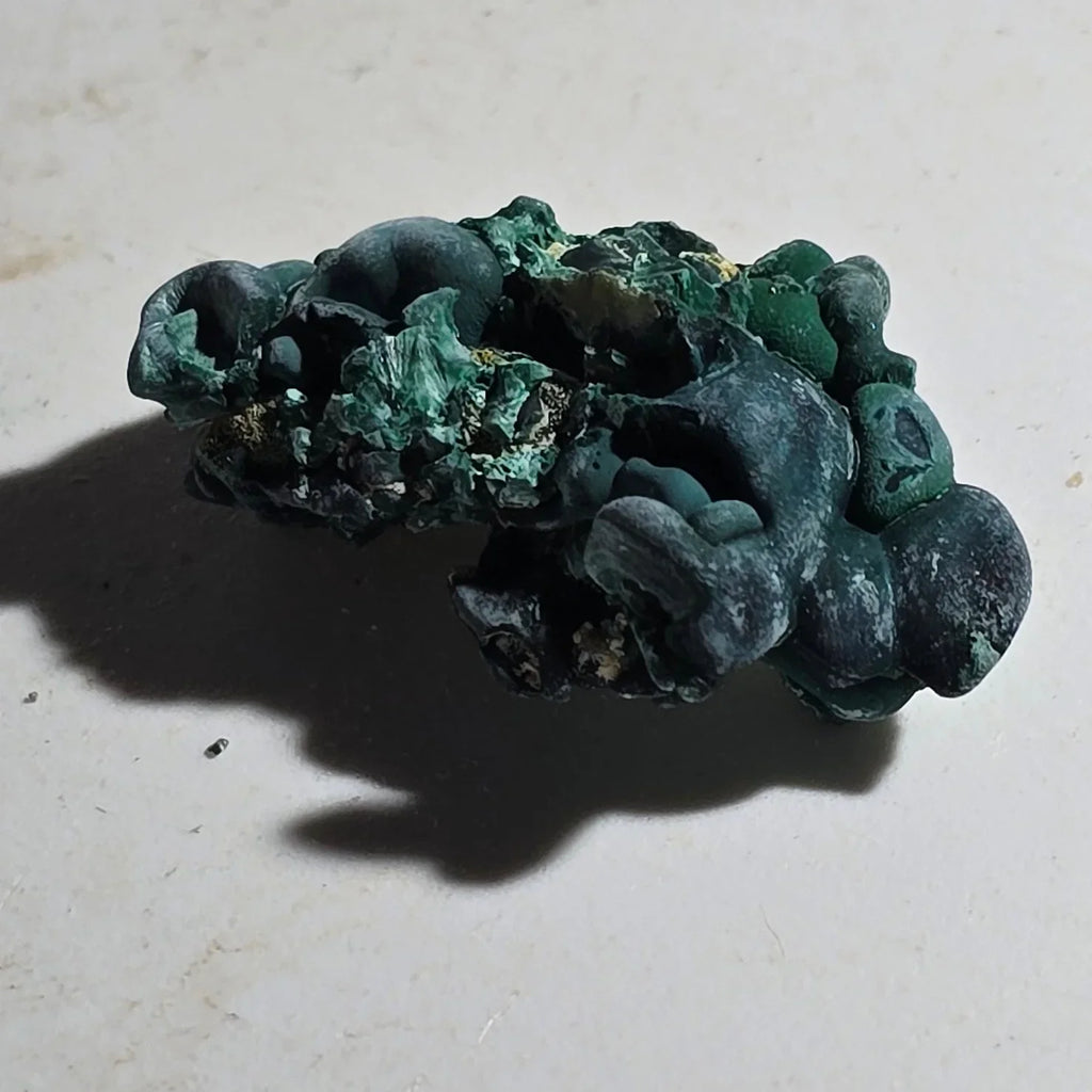Malachite mineral specimen with botryoidal texture, vibrant green crystals on matrix, collectible geological specimen