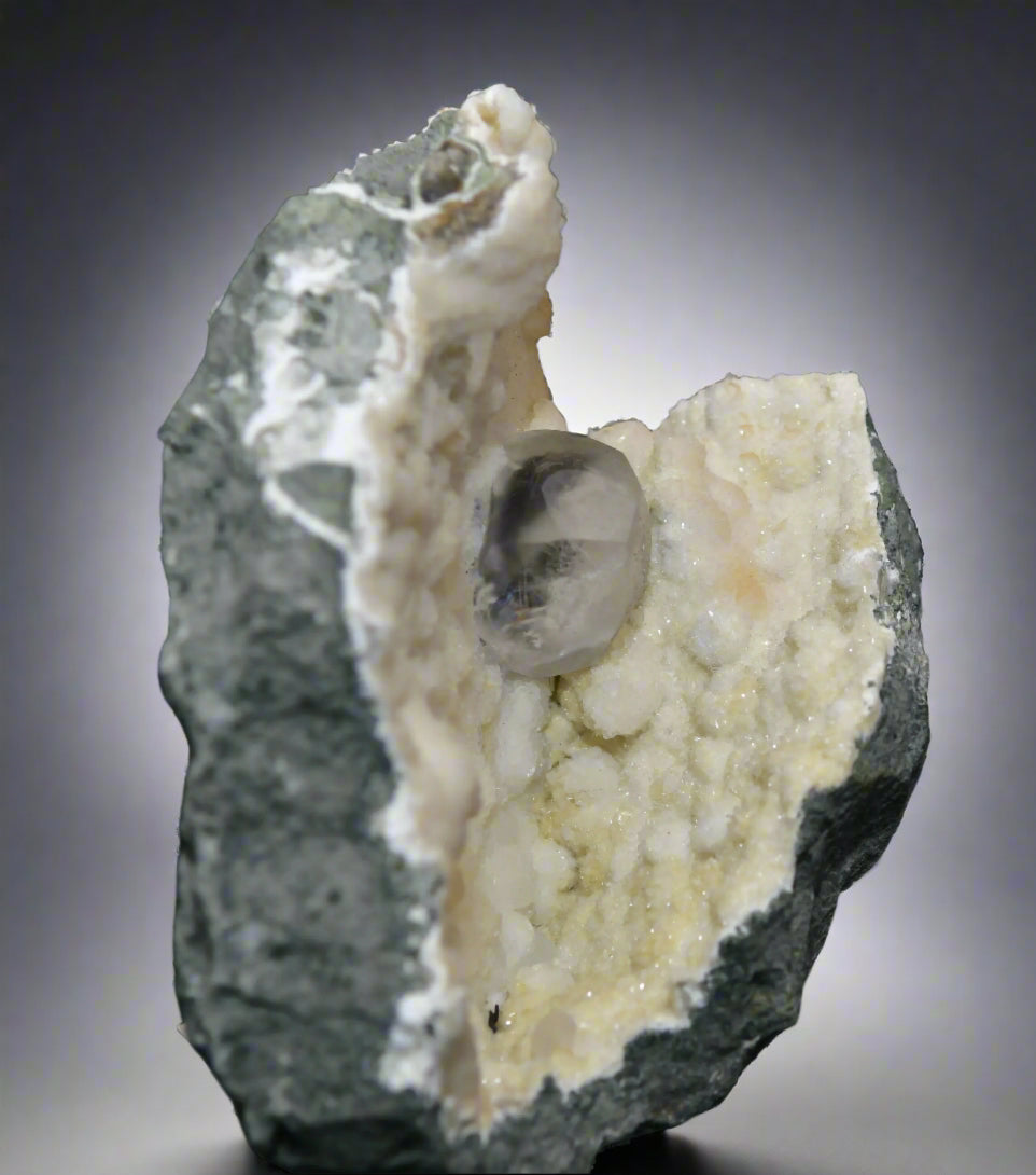 APOPHILLITE (4 cm large single crystal) on ARAGONITE (cabinet)