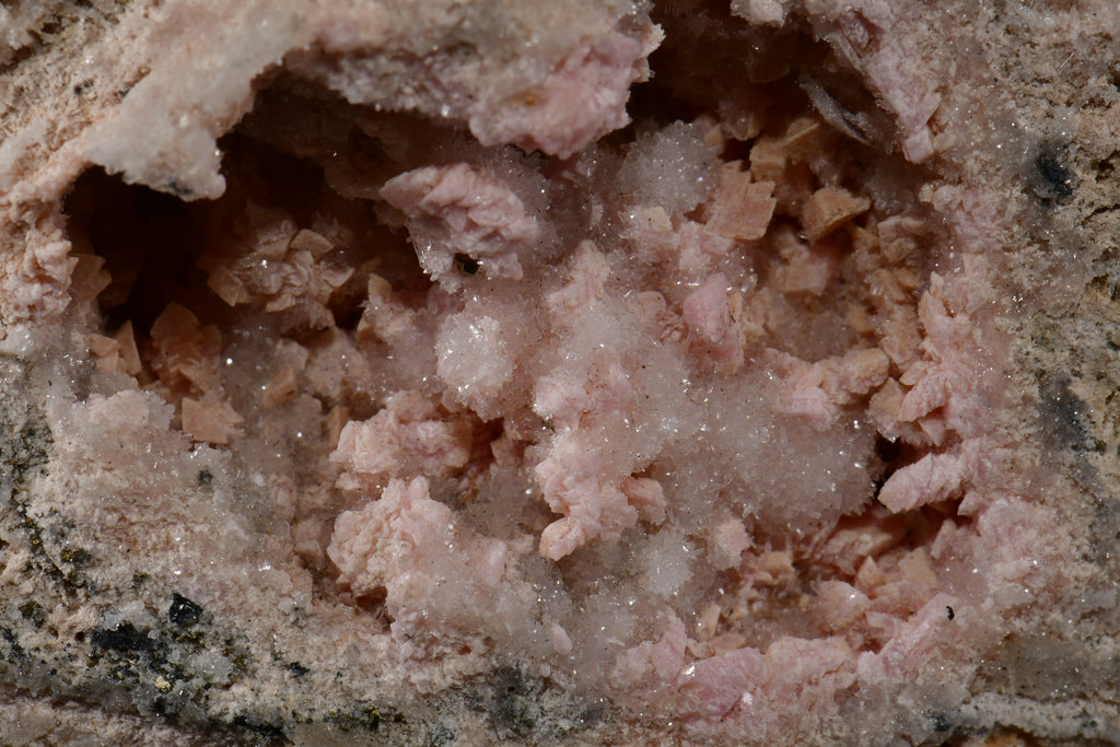 RHODOCHROSITE associated with PYRITE, QUARTZ (small cabinet)