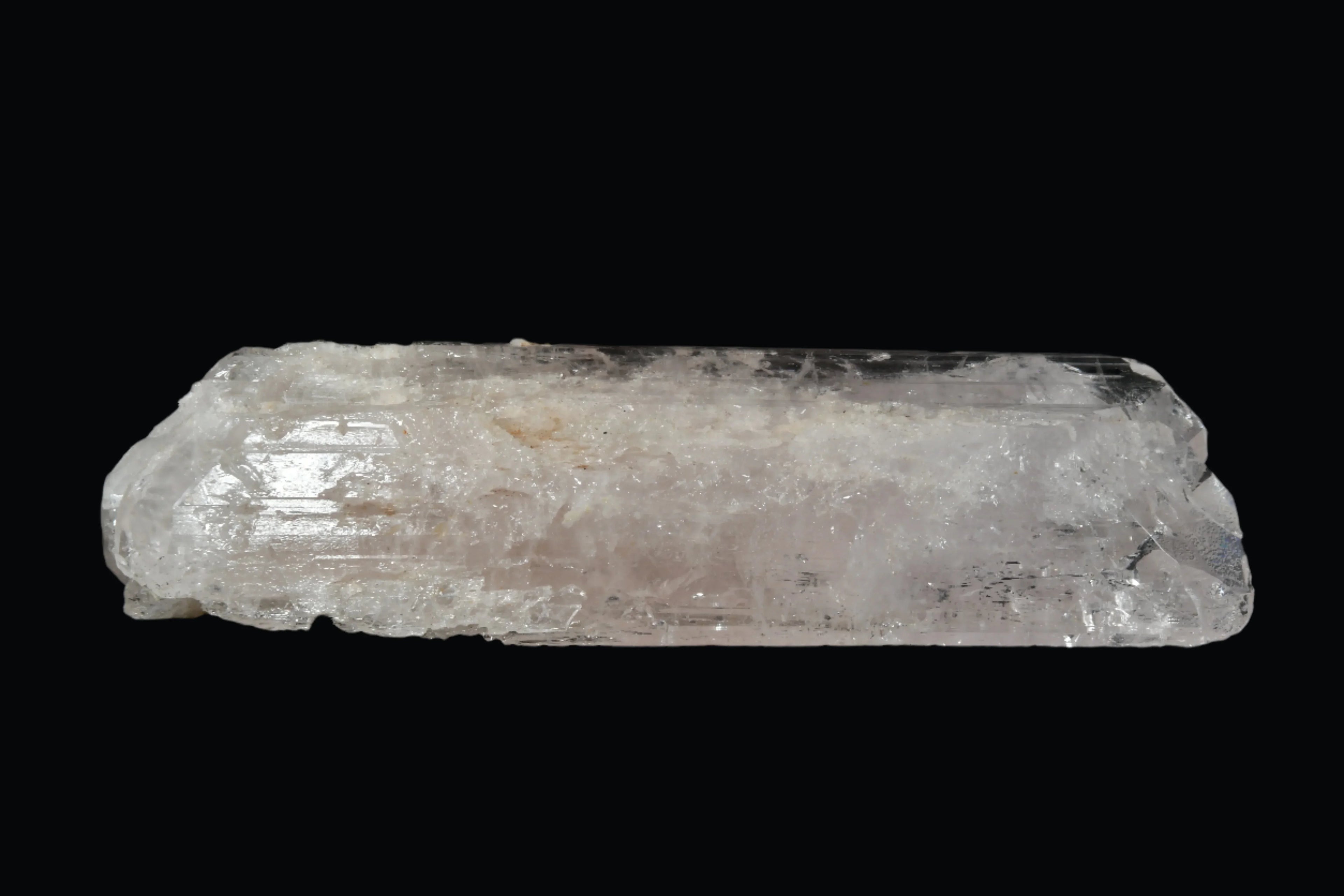 Clear quartz crystal specimen with natural striations and inclusions, ideal for mineral collectors