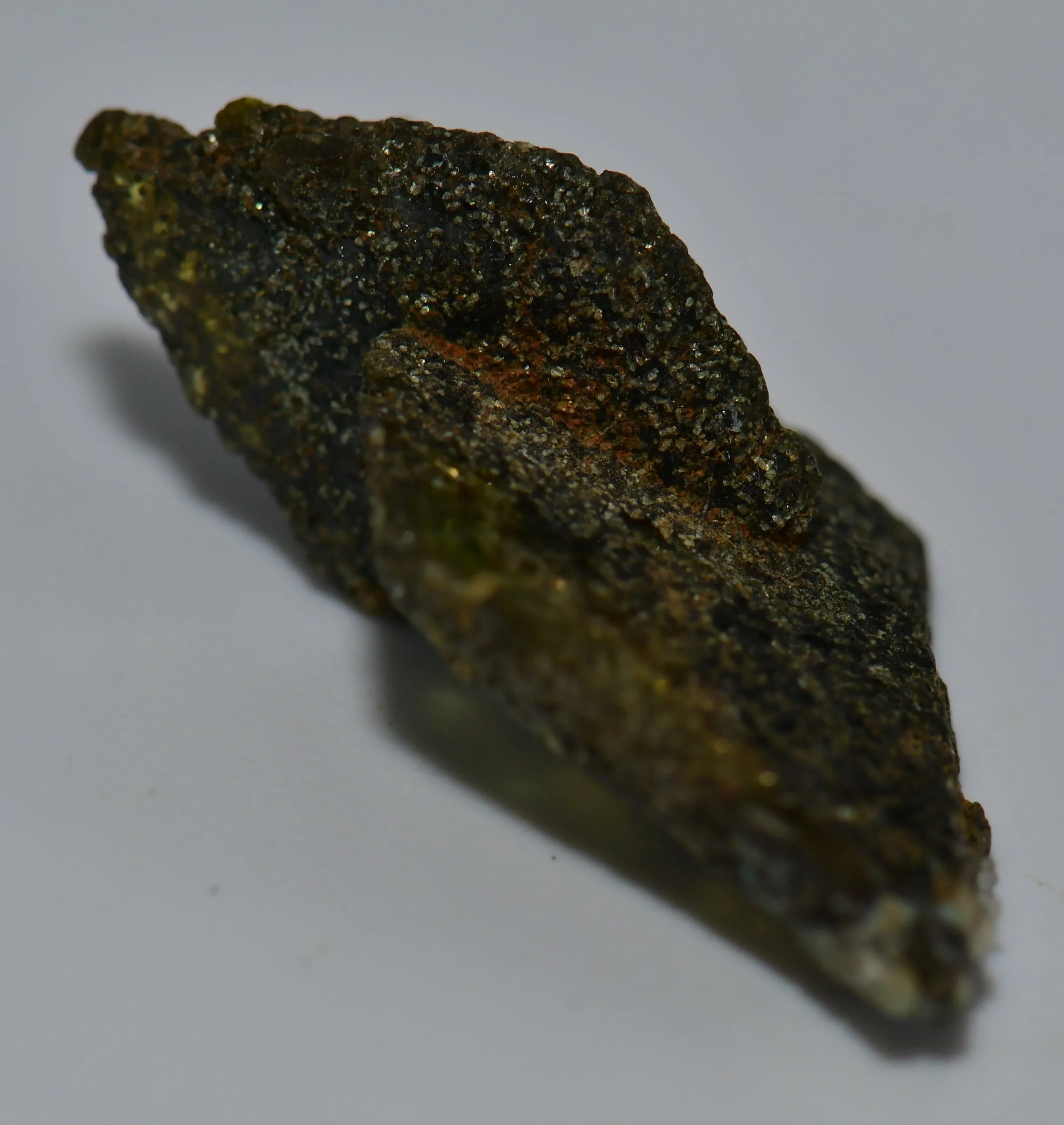 Chalcopyrite mineral specimen with metallic luster and greenish-gold hues, natural crystal formation