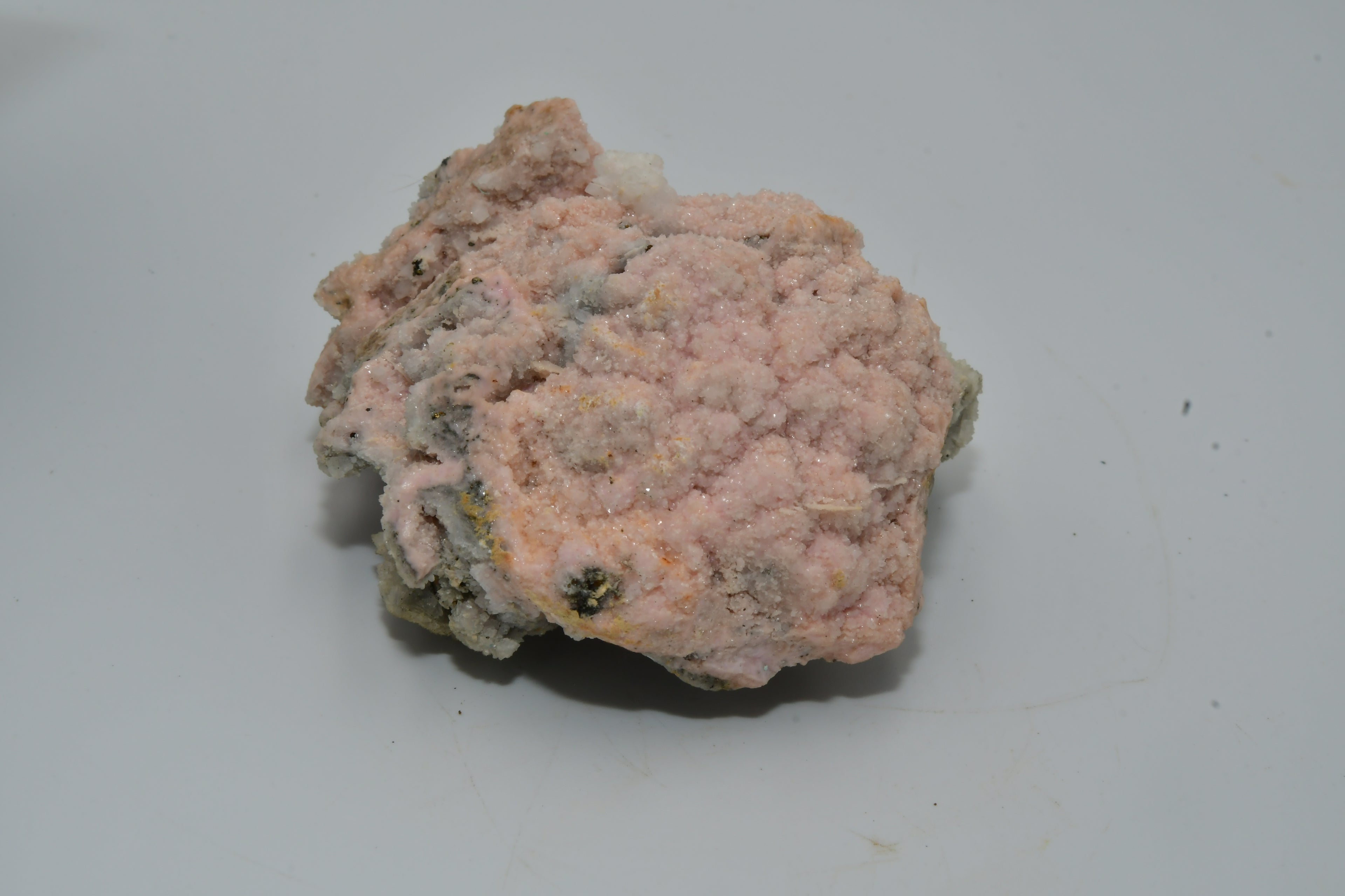 RHODOCHROSITE associated with PYRITE (small cabinet)