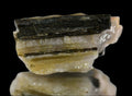 Schorl Tourmaline on Quartz crystal specimen, layered mineral formation with dark striations and clear bands